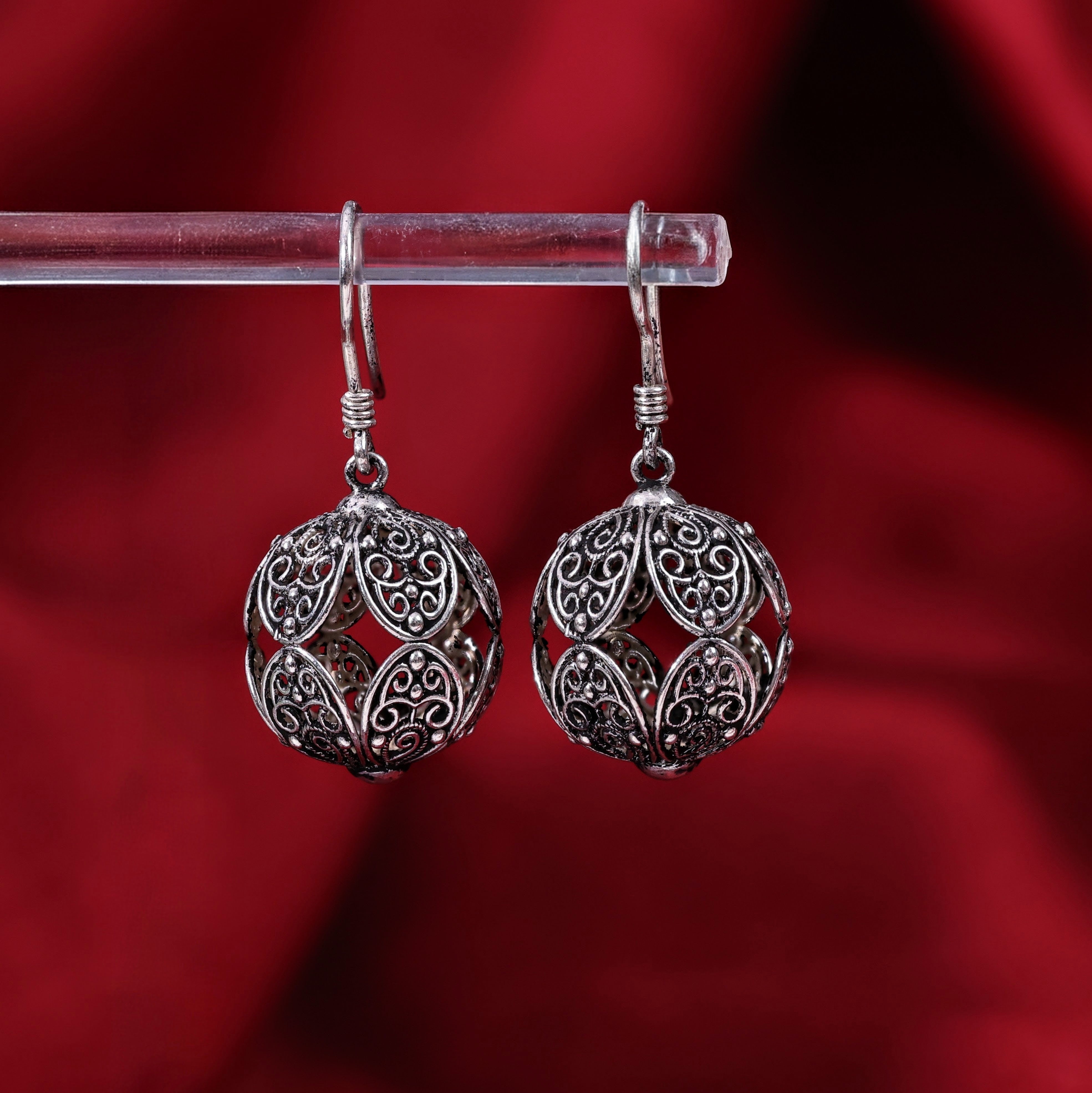 Handcrafted sterling silver filigree sphere drop earrings with intricate openwork design and fish hook closure 